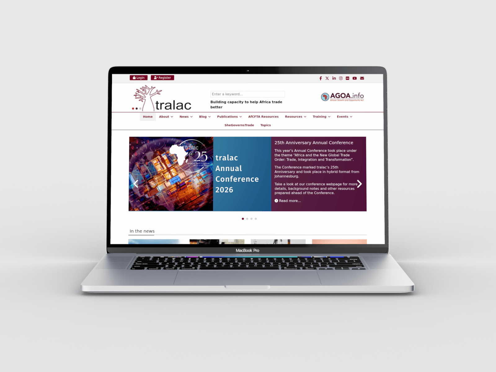 A laptop showing the tralac homepage, with news and the annual conference.